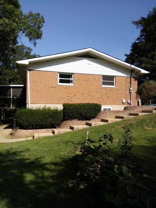 Gentle sloping concrete from front of house to the LL entry to the apartment