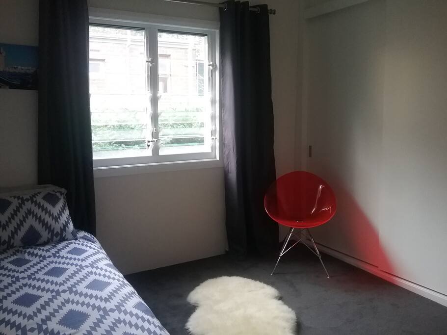 Thick curtains & carpet, louvre windows for catching the breeze