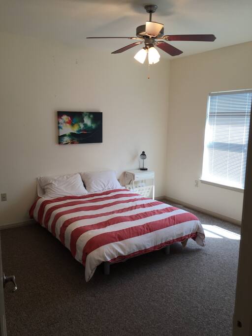 Master bedroom with bathroom access and walk in closet.
