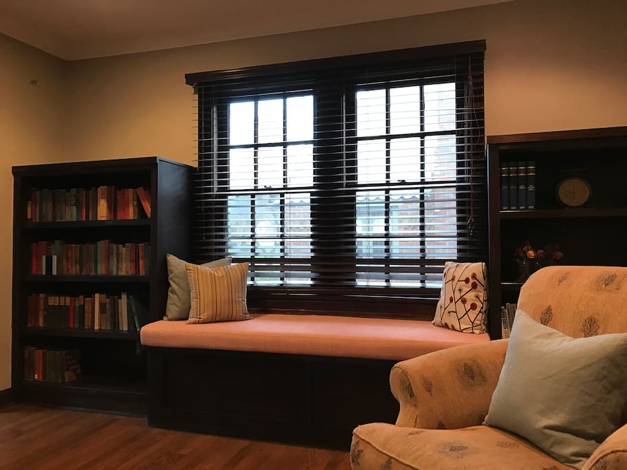 Built in cabinets with reading nook on main floor