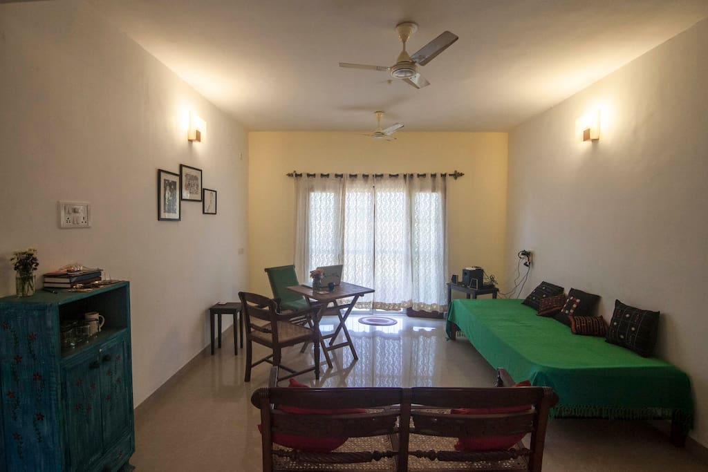 The Living Room. Behind the curtains is the balcony