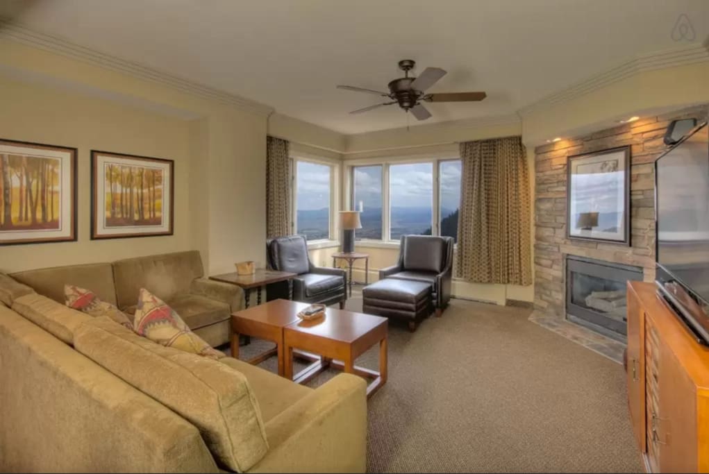 Newly remodeled Plaza unit Living Room with a fireplace, big screen TV, and view of Carson Valley.