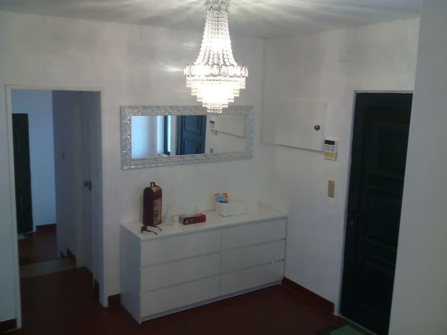 Hall with 2 steps down to the kitchen area.