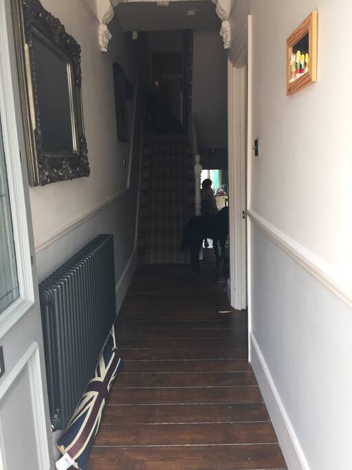 Entrance hall with feature column radiator and mirror