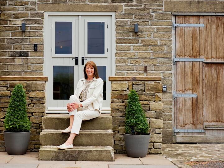 Image of Anita sitting on a staircase