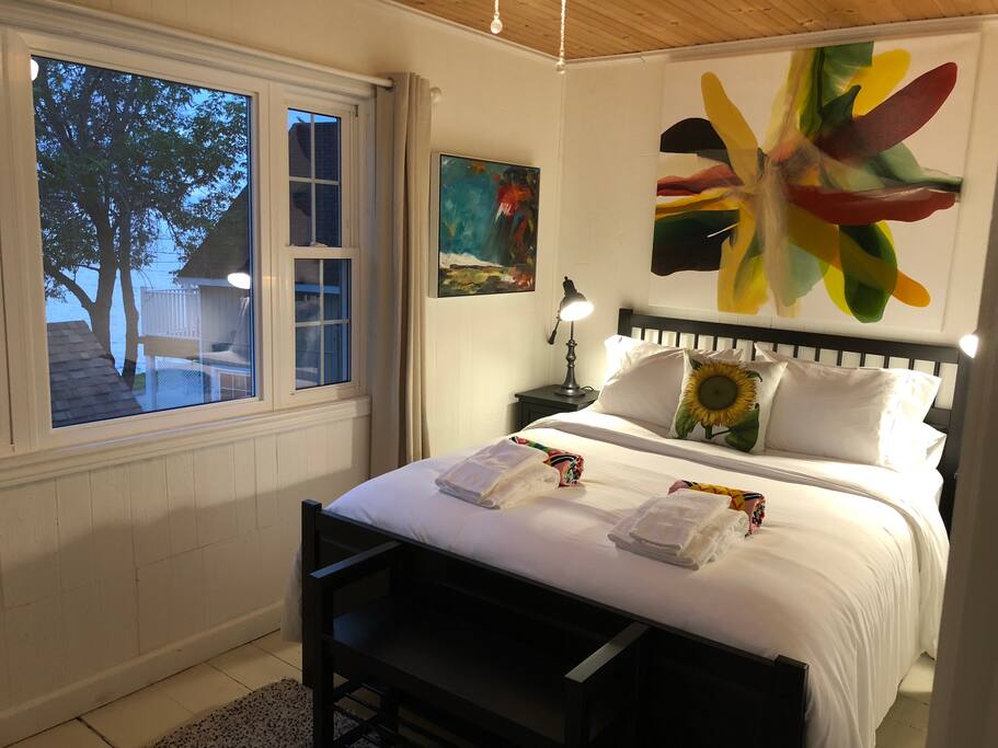 Private bedroom with Queen size bed and a lake view.
