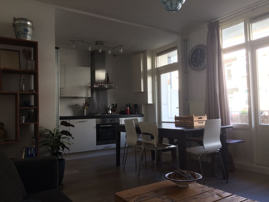 Table with 6 seats and the kitchen