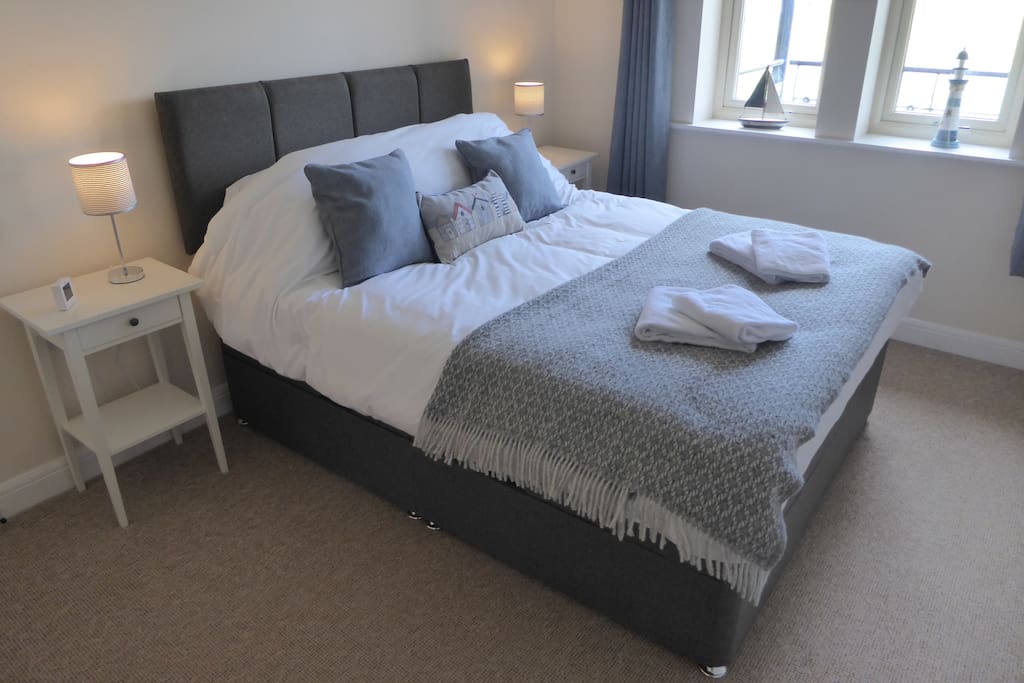 King size bed and built in wardrobe.
