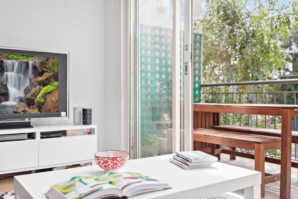 Large living room with balcony access. Large couch, big TV. North facing. Crome cast available, 100 plus movies at your choice