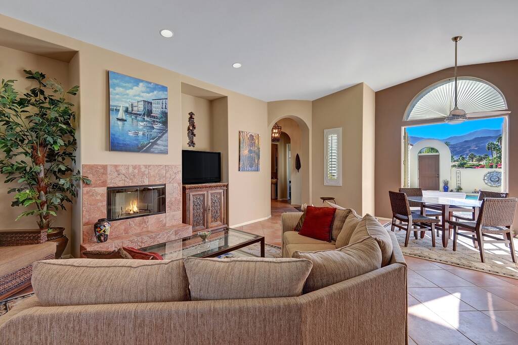 Large Sectional Couch Adjacent to Dining Room