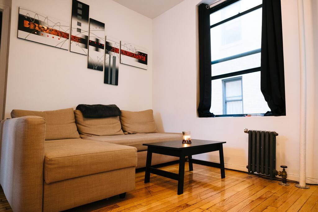 Spacious Living Room with a 55" TV and candles galore