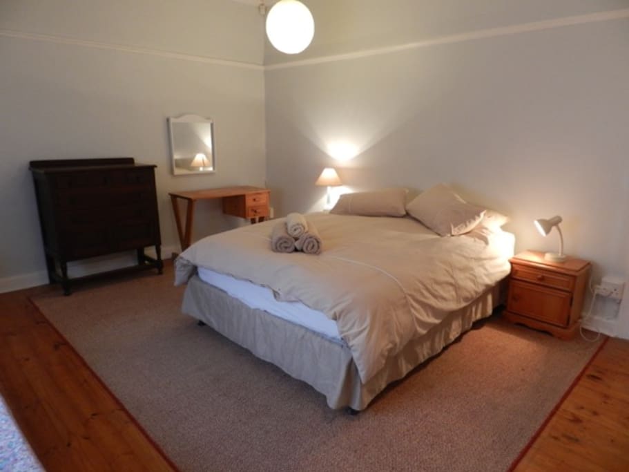 Main bedroom with queen size bed and king duvet