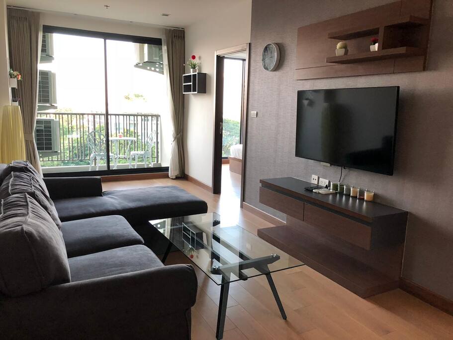 A view of the living room with big smart TV connected to the Internet