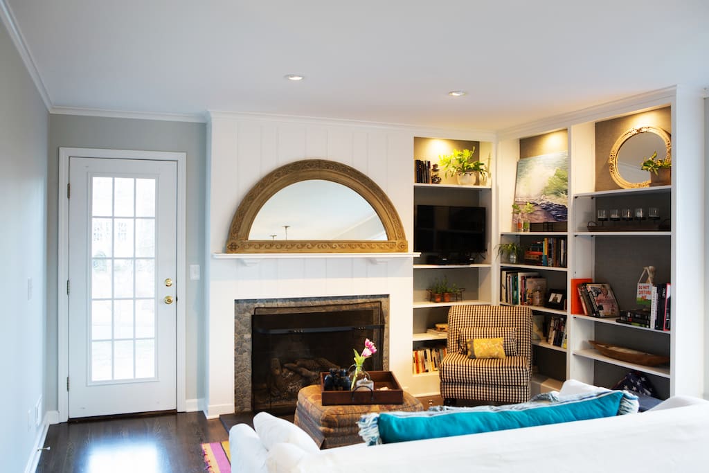 Living room with gas fireplace and cable TV..