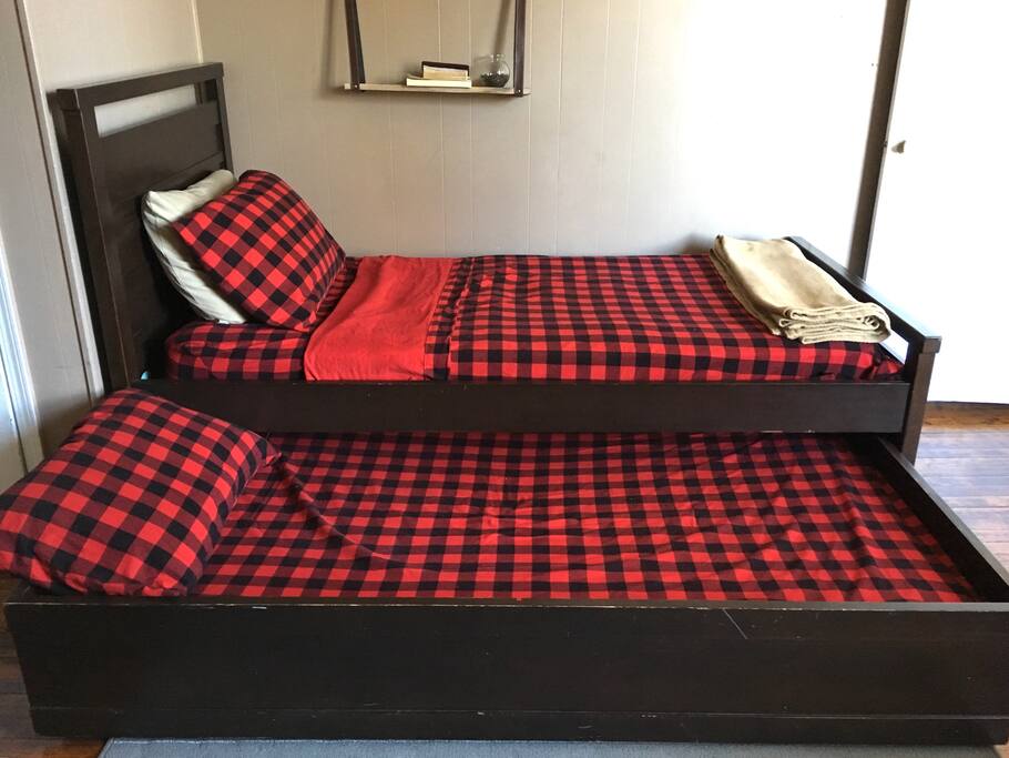 Twin trundle bed pulls out into an additional twin bed