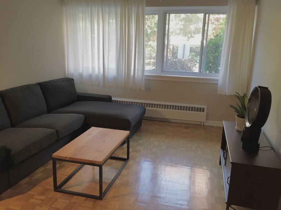 Wall-to-wall windows make for bright, spacious living area.