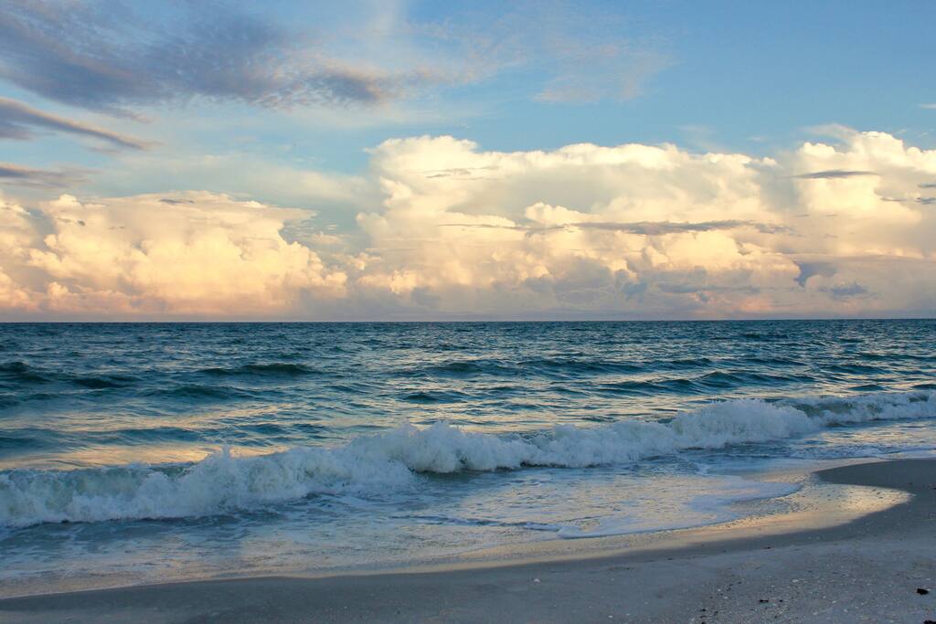 As the sun begins to set down by the shore