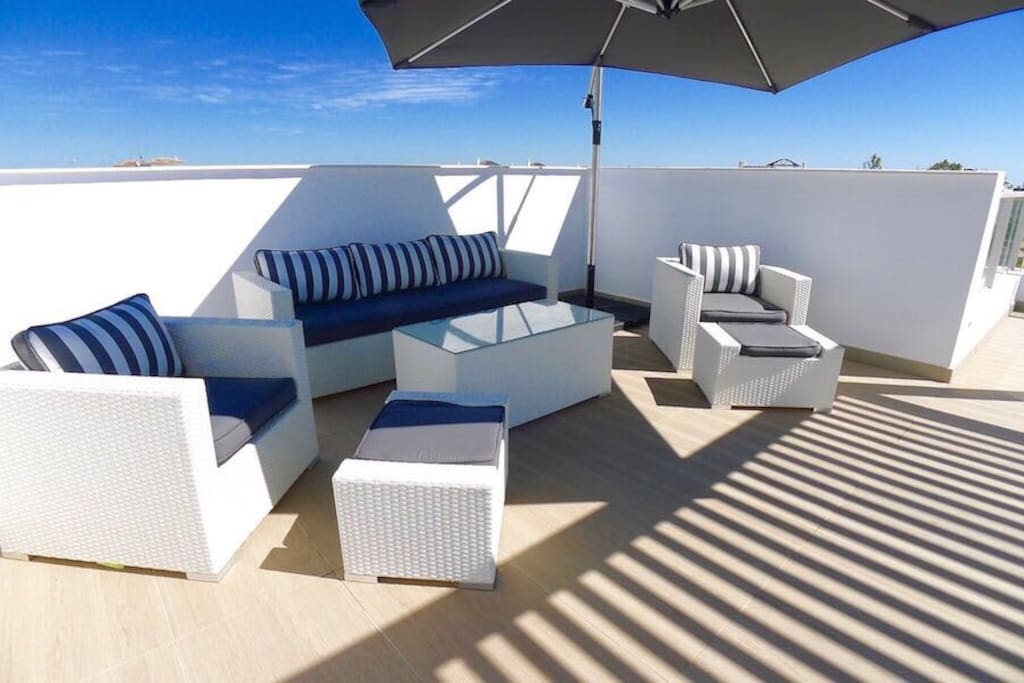 part of the roof terrace, with views of the sea and the mountains
