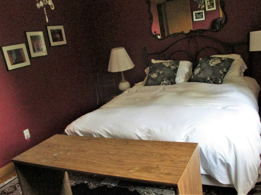 Queen sized bed and a desk. This room has a nice view.
