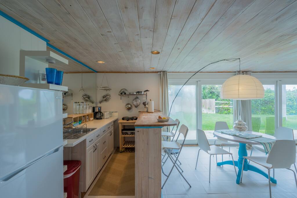Small kitchenette with dishes, silverware, large fridge/freezer, small two burner cooking, large toaster oven for small pizzas, casseroles, etc., microwave and plenty of pots, pans, utensils to live like a larger "kitchen." (But please keep in mind it is a kitchenette.