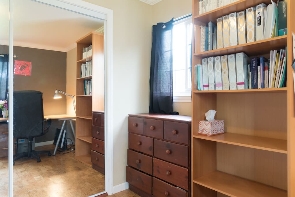Your room- mirrored closet doors on the left, dresser and book shelf to the right.