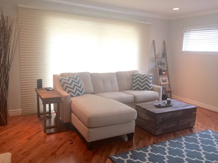 Coffee table, end table, ladder shelves and entertainment center are all custom hand-built reclaimed wood pieces built right here in Delray!