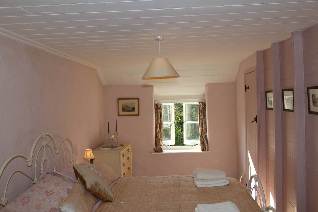 Double bedroom with view out onto the private garden.