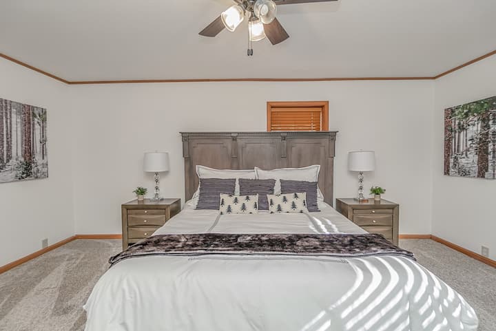 Second floor master suite with a king bed and a single/twin sized bed. An en suite bathroom with dual sinks offers privacy during multi-family vacations