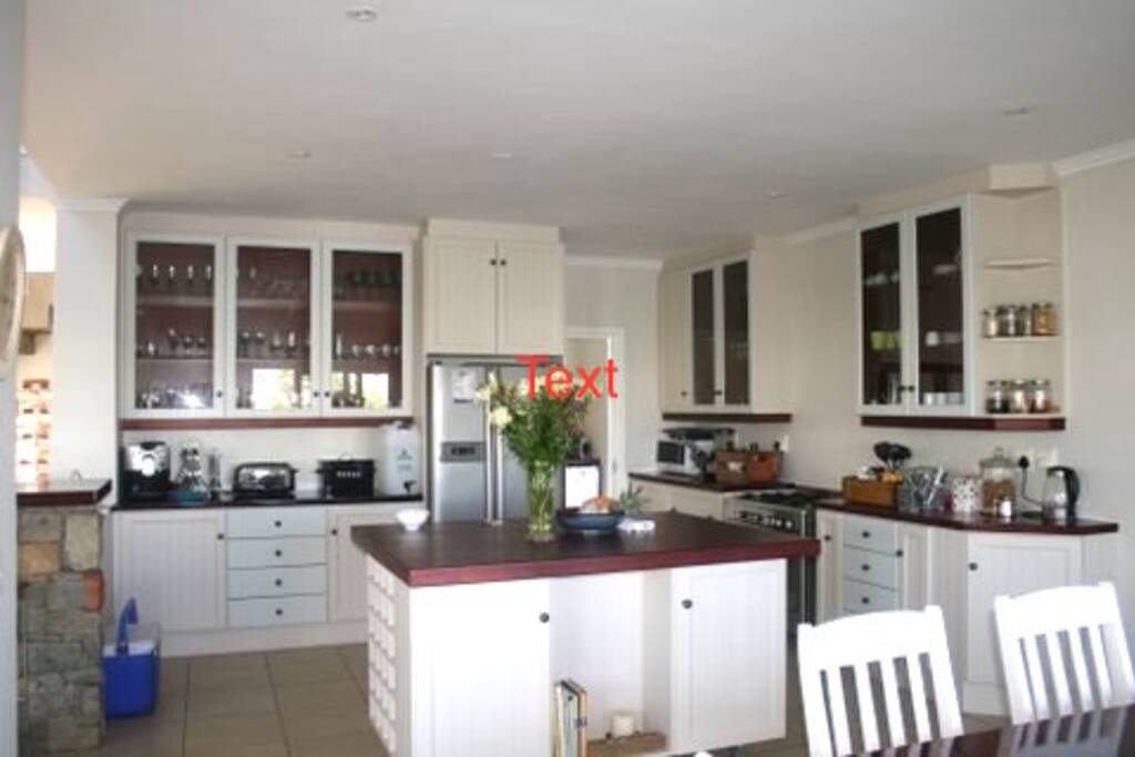 Kitchen leading into the dining room where cooking is a social event.