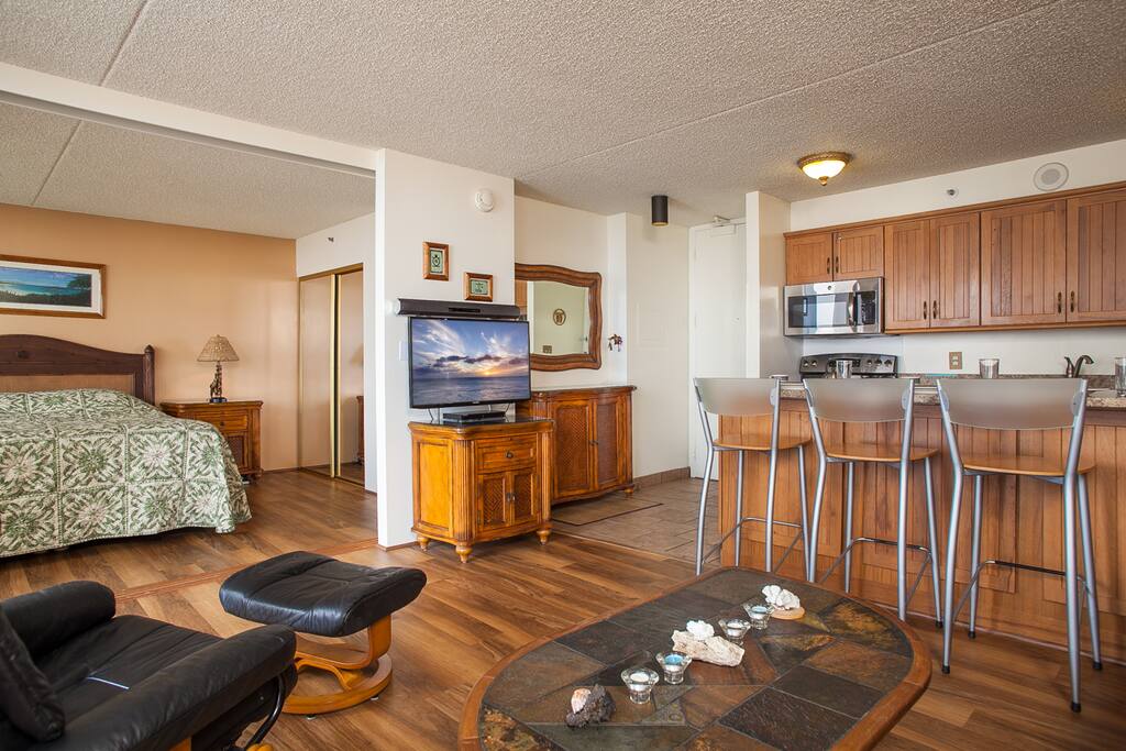 Kitchen and master bedroom with flat screen TV.