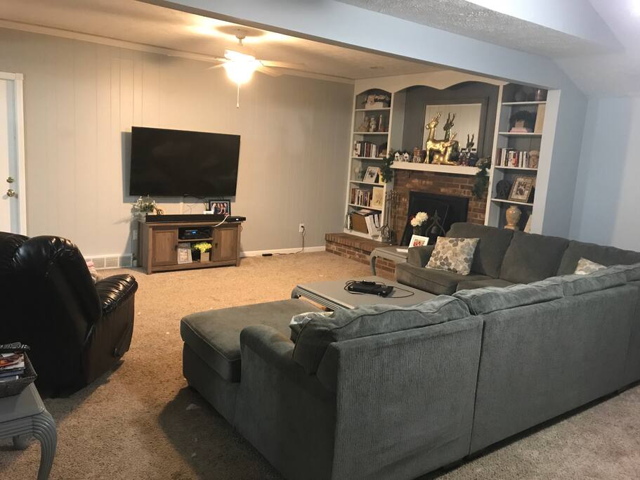 Family room with 60" Smart TV with cable and NetFlix, fireplace, and plenty of seating (first floor)