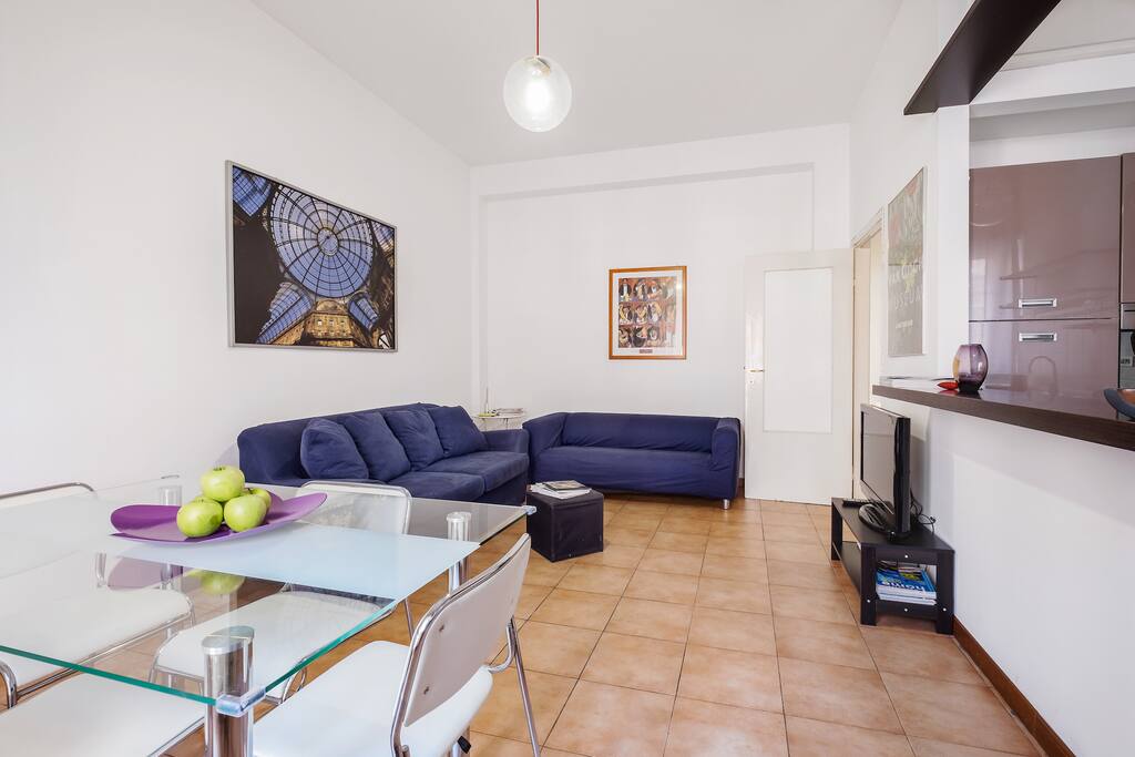 The Living room with the dining table & the sofa bed x2