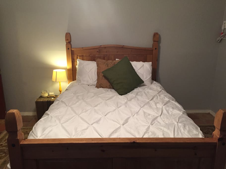 Queen bed with extra pillows