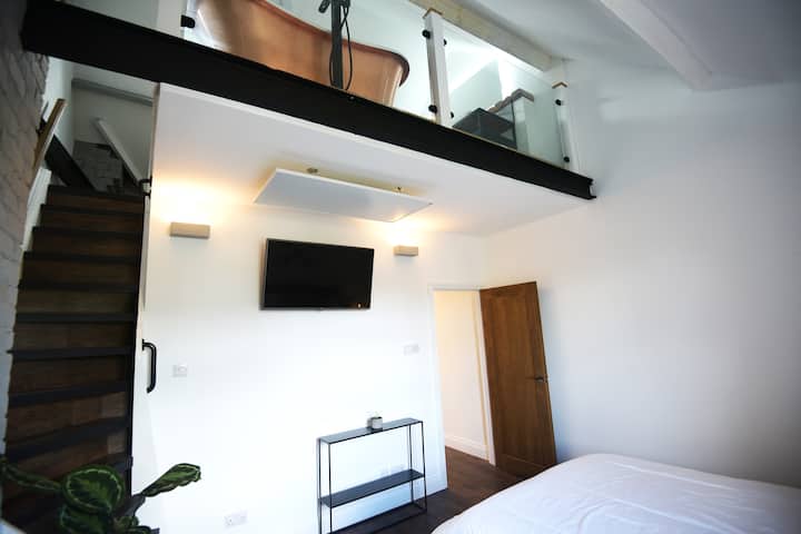 Mezzanine bathroom viewed from the king bed.
