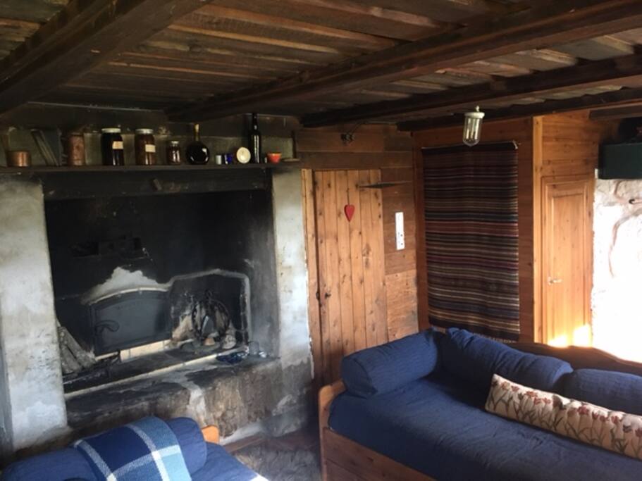 Fireplace that used to be used for making bread! Cozy on cooler days.