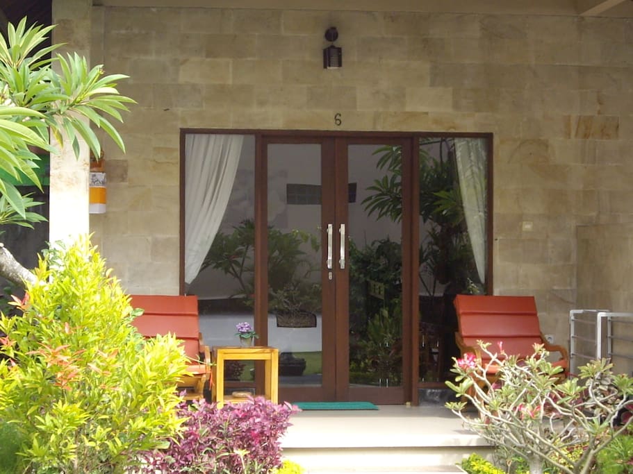 Garden View Room with Table and Chairs on the verandah for your relaxation