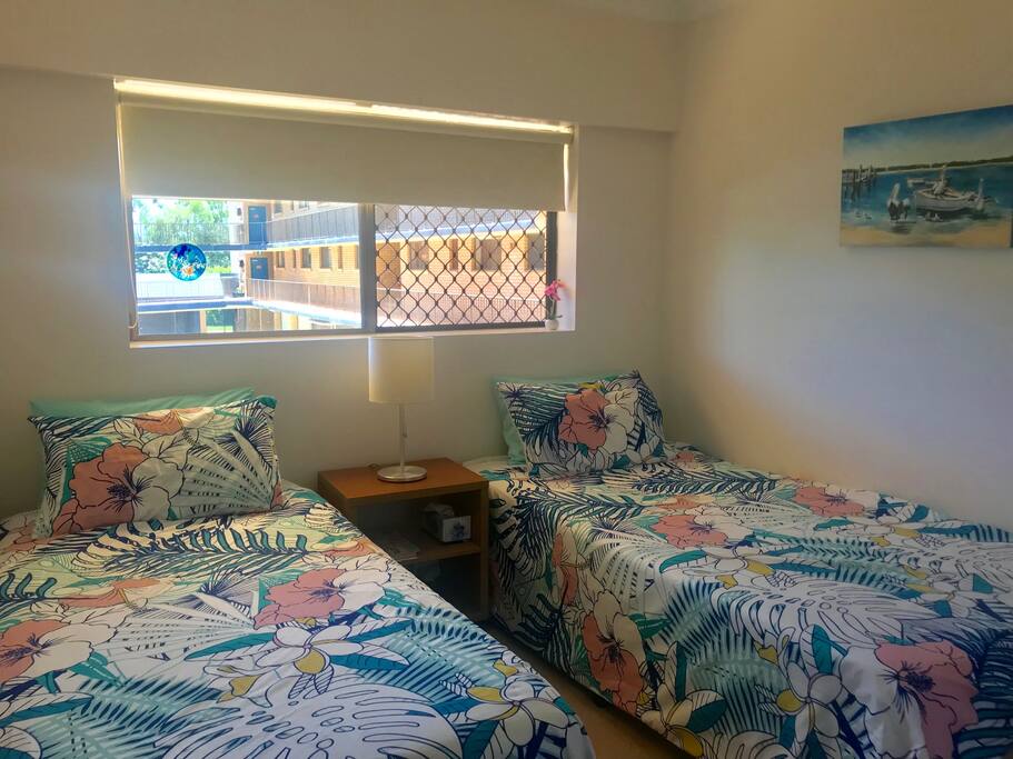 Private bedroom with king single and single beds.