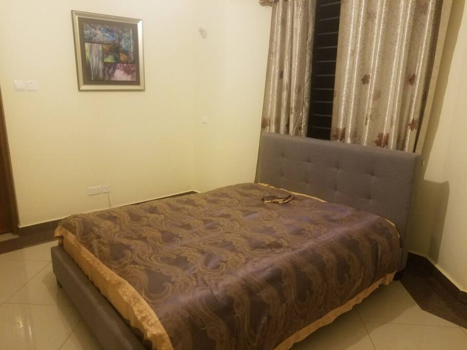 Queen Size Bed in a master ensuit room.