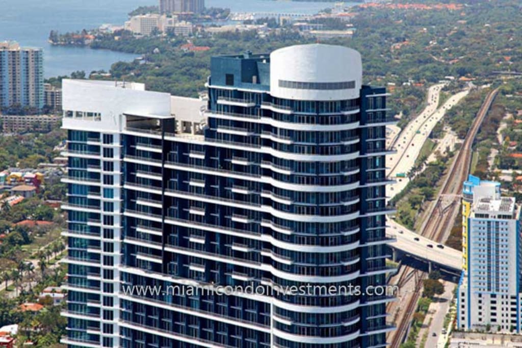 Apartment offers scenic views of the beach and city.