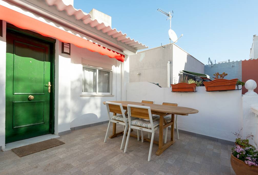 Front door with terrace. With big awning.