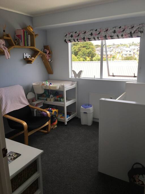 Babys room with cot and change table