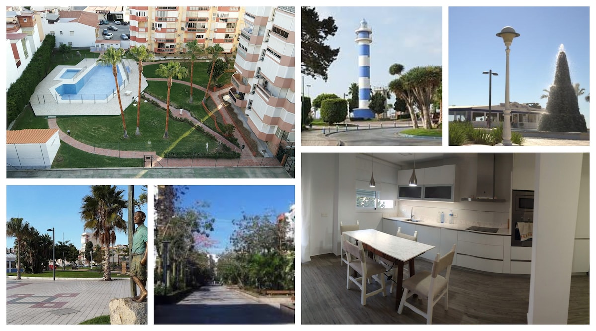 A landscaped area is highlighted, featuring a swimming pool surrounded by palm trees and pathways. Nearby, a distinctive blue and white striped lighthouse is visible, accompanied by modern street lamps. A bright, airy kitchen with white cabinetry and a dining table is also showcased.