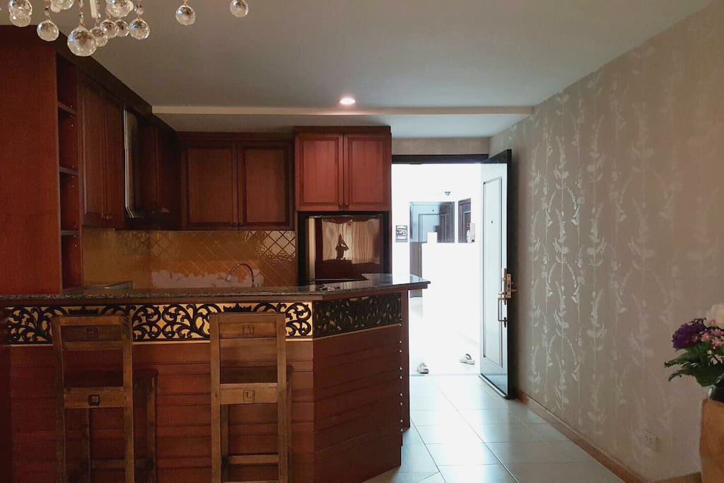 Decorated kitchen with electronic stove, microwave and refrigerator