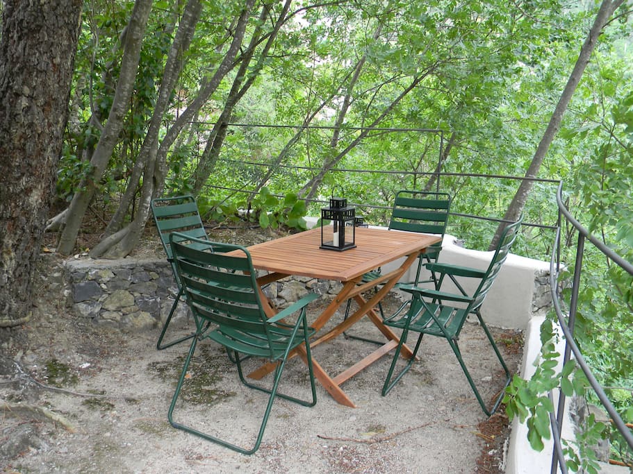 The back side is cosier and secluded, shaded by vegetation, so it is an ideal place for having lunch in summer.
