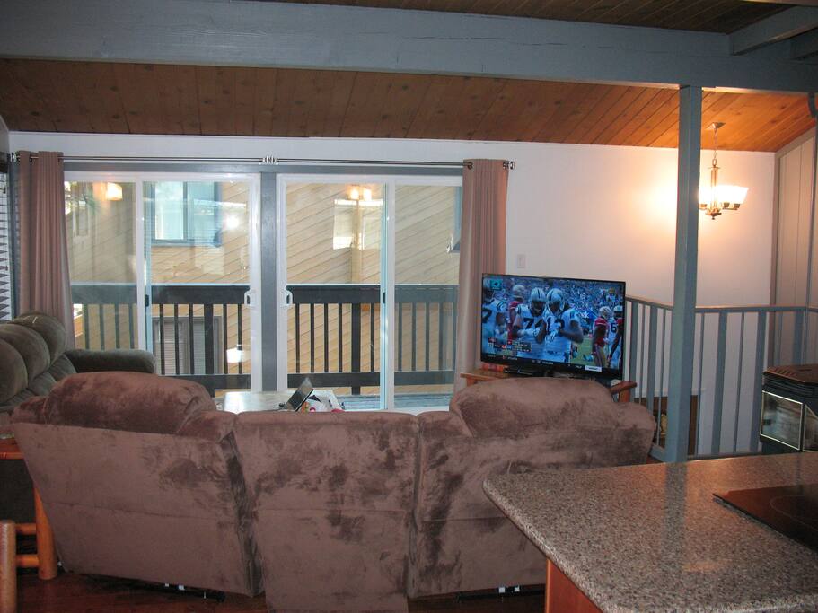 55" Smart T.V., private balcony, vaulted ceilings and pellet stove.