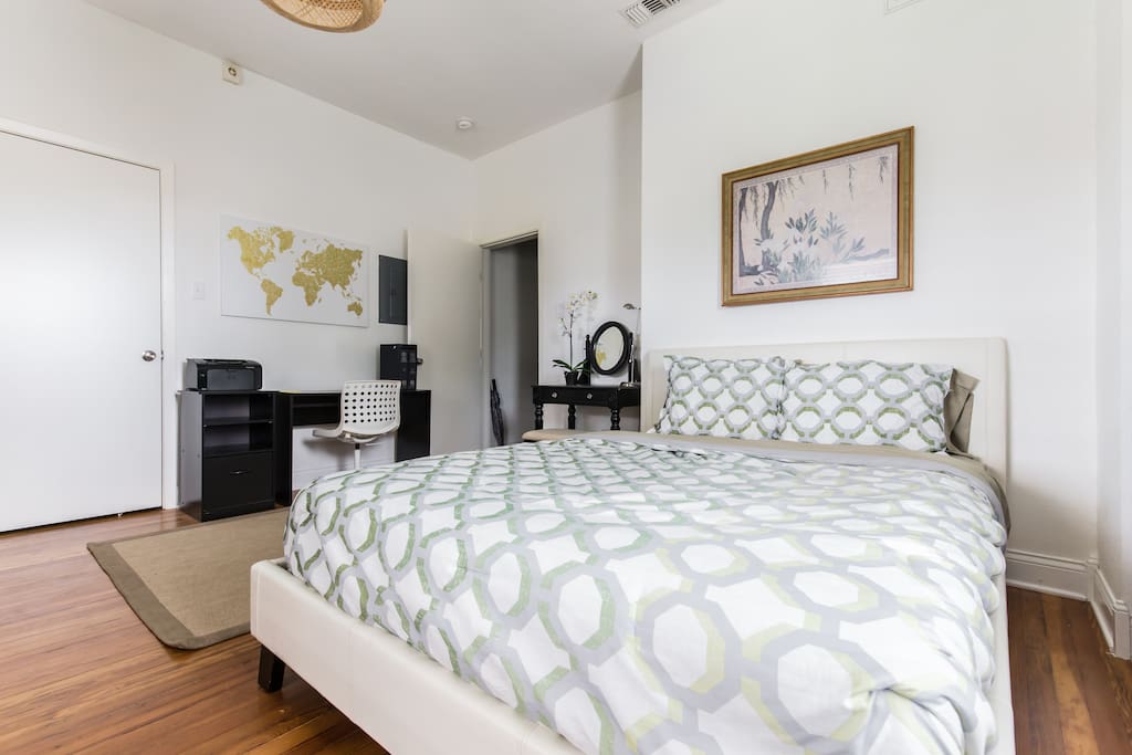The master bedroom opens onto the balcony and features a queen bed with enough room for a queen air mattress if you're traveling with friends.