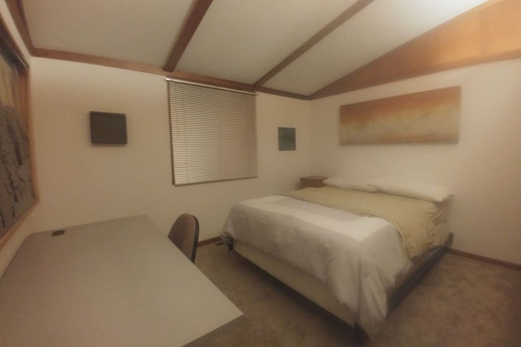 Queen bed, desk & chair, closet w/ hangers, lockable door w/ key.