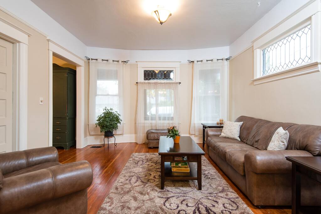 High ceilings, beautiful original hardwoods & crown molding