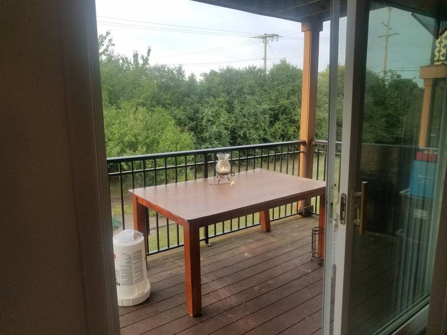 Patio table with evening candles. This serves as the dinner table for the apartment.