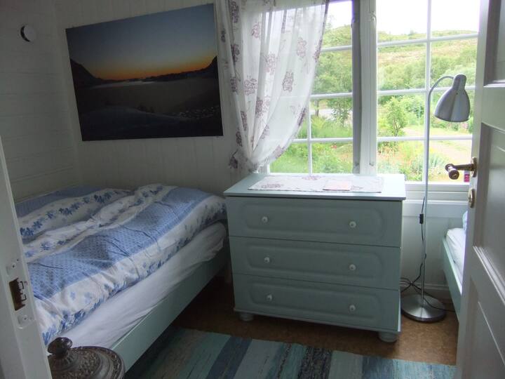 The bedroom, double bed to the left, a single bed to the right